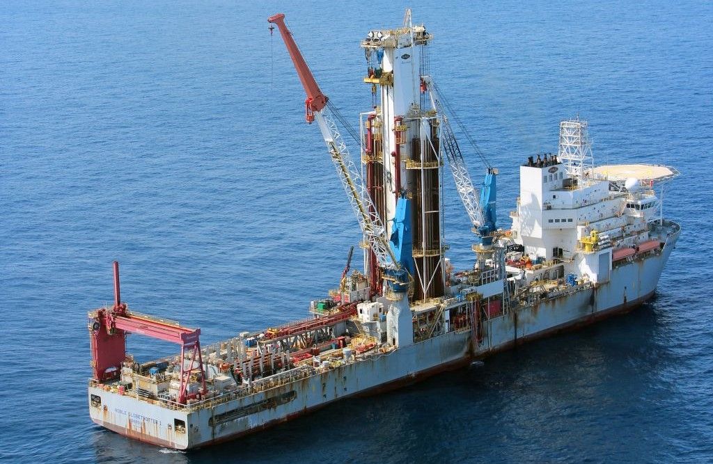 Offshore drilling ship on calm sea waters.