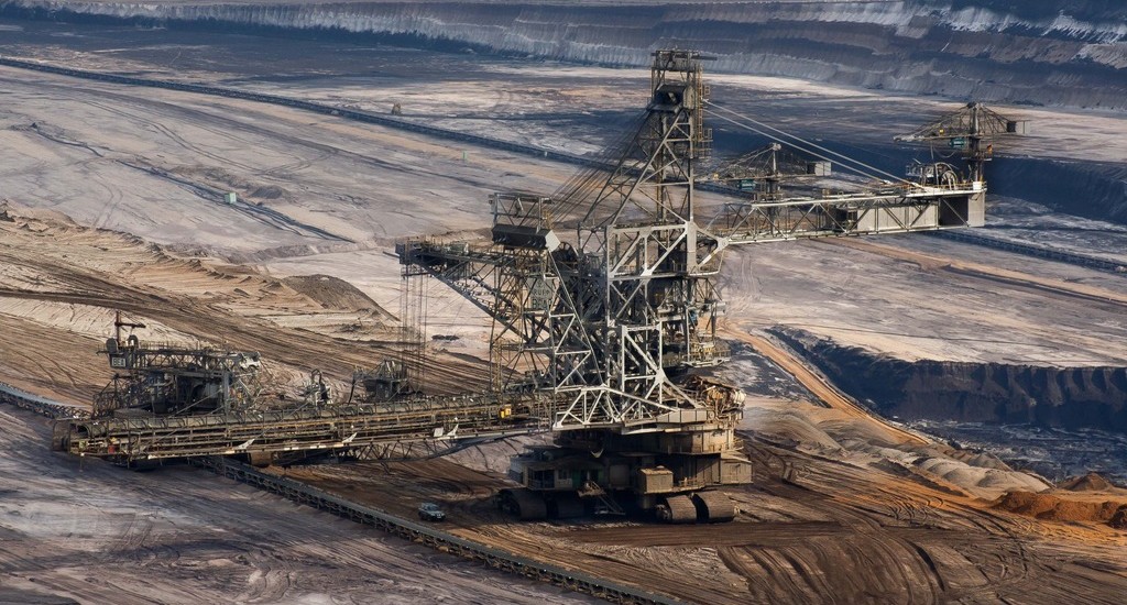 Large industrial mining excavator in an open-pit mine.