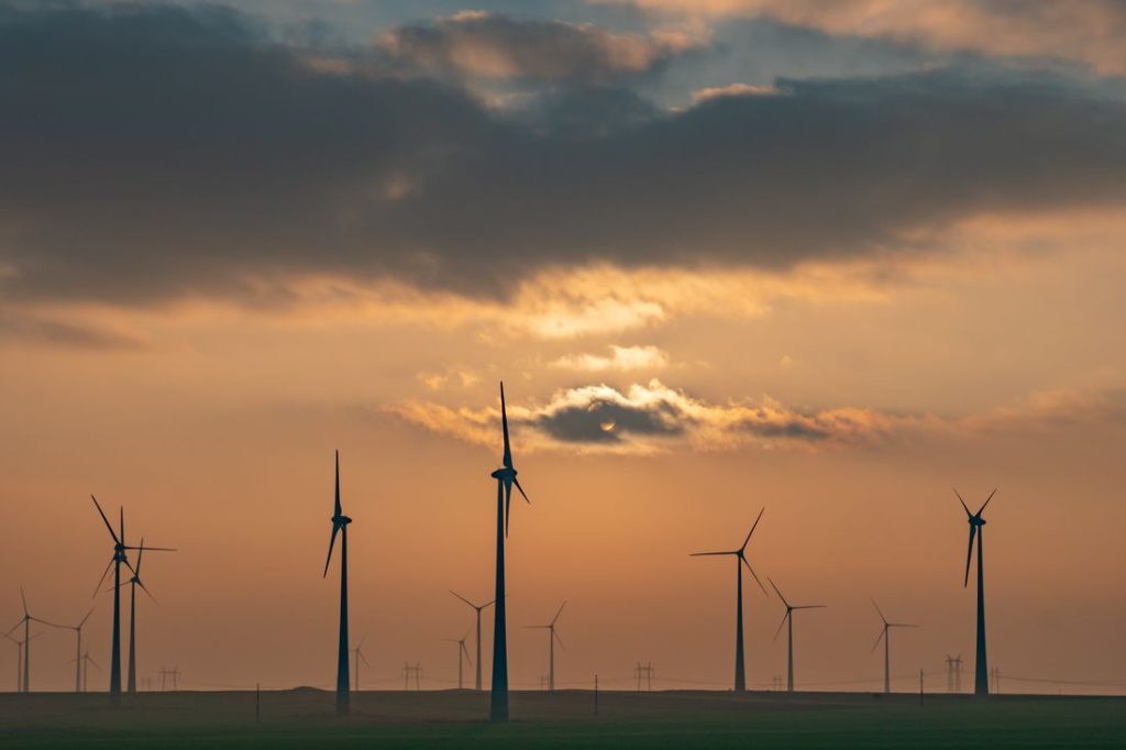 wind-turbines-sunset-cloudy-sky.jpg